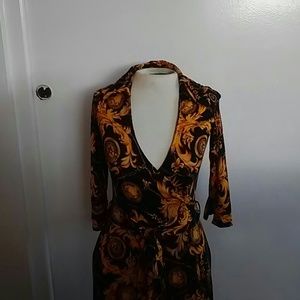 Cute Gold/Black Wrap dress with tie back.
